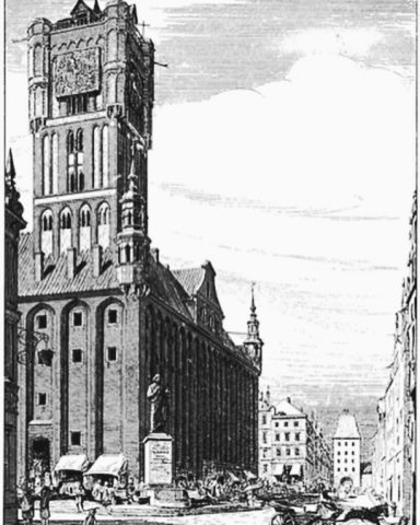 Historisches Gebäude mit hohem Turm und umliegenden Straßenansichten.